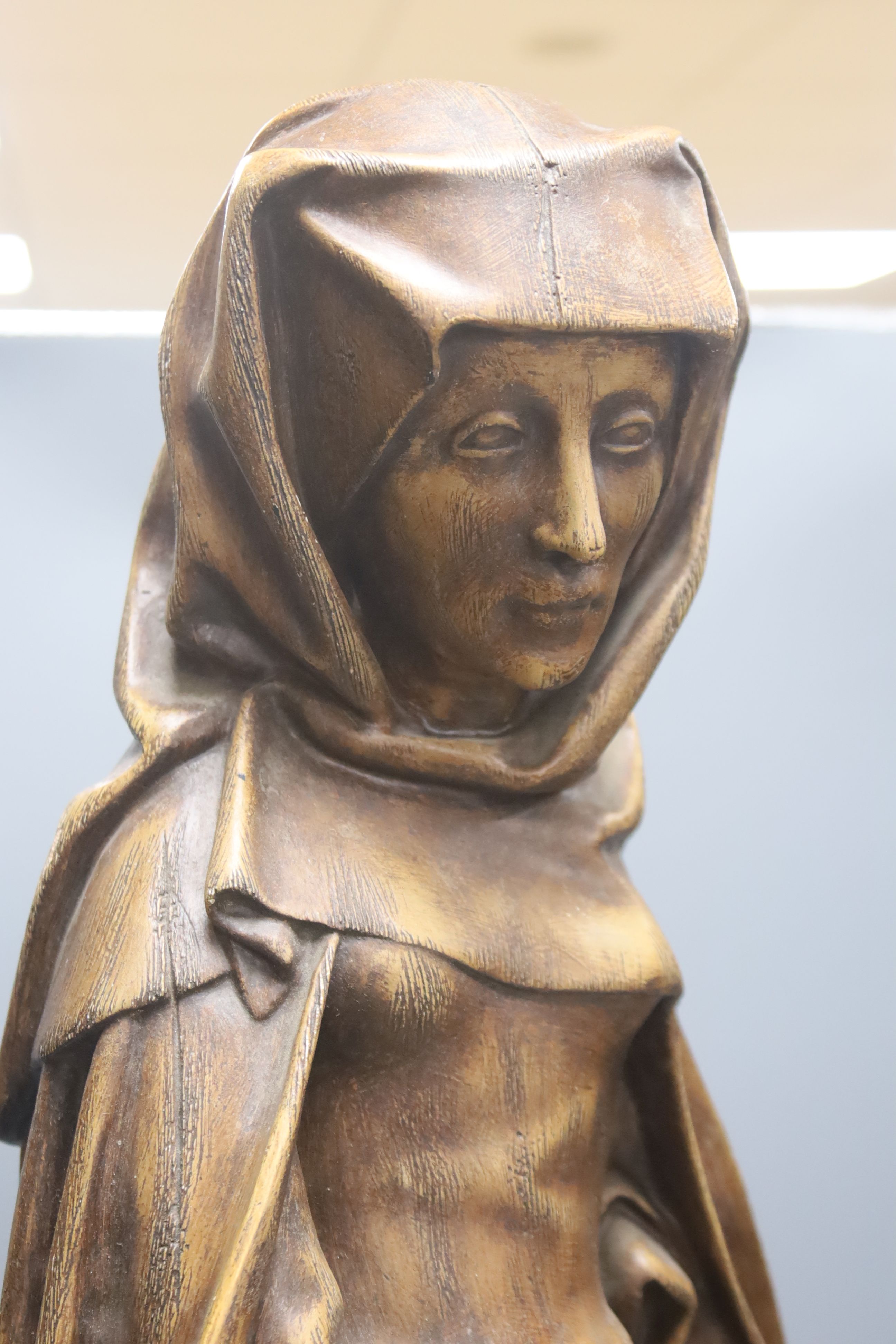 A large painted plaster statue of St Martha, height 70cm